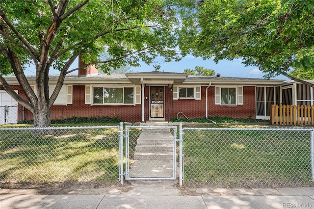 1280 Xanadu St, Aurora, CO 80011 - ranch-style home with brick siding, a gate, a fenced front yard, and a chimney