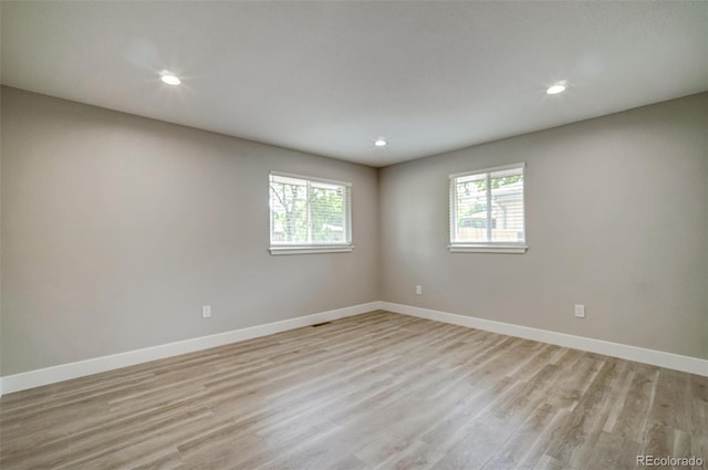 363 Lima St, Aurora, CO 80010 - spare room with baseboards, light wood finished floors, and recessed lighting