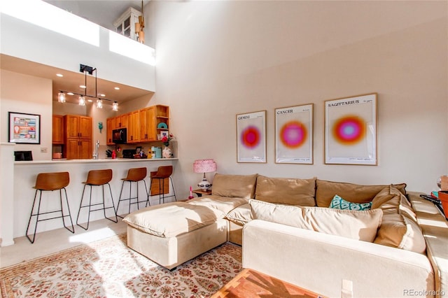 living room with a high ceiling