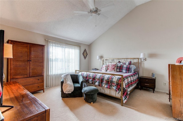 bedroom featuring ceiling fan, lofted ceiling, light carpet, and a textured ceiling