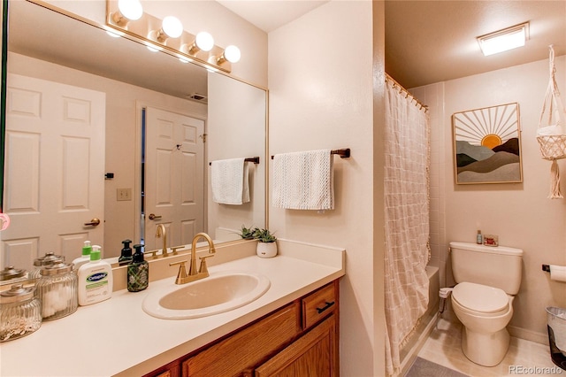 full bathroom with vanity, toilet, tile patterned flooring, and shower / bath combo