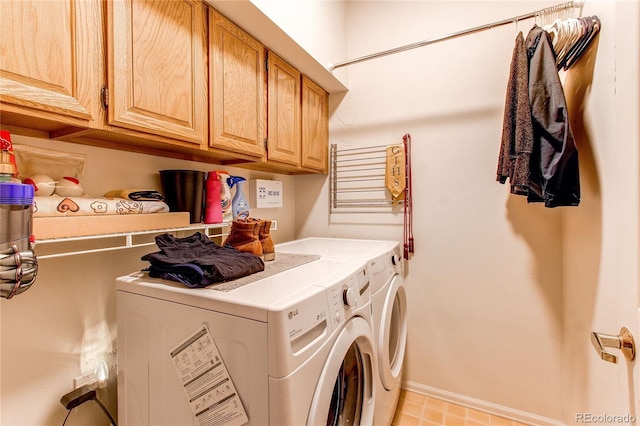 laundry area featuring cabinets and separate washer and dryer