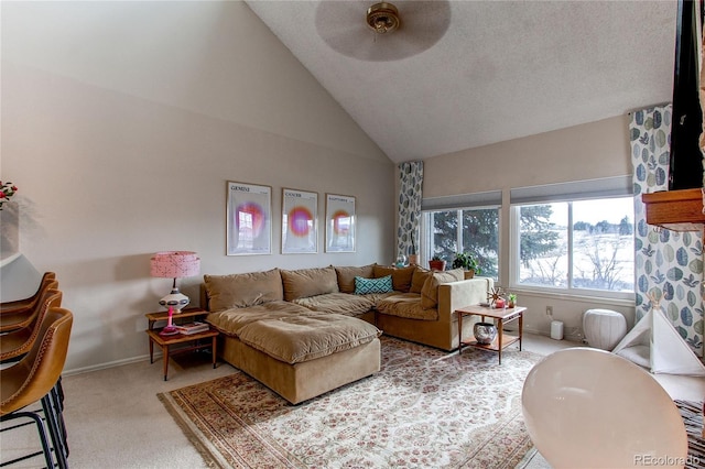 carpeted living room featuring high vaulted ceiling