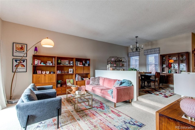 living room with a notable chandelier, light colored carpet, and a textured ceiling