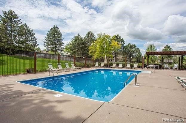 view of swimming pool with a lawn, a patio area, and a pergola