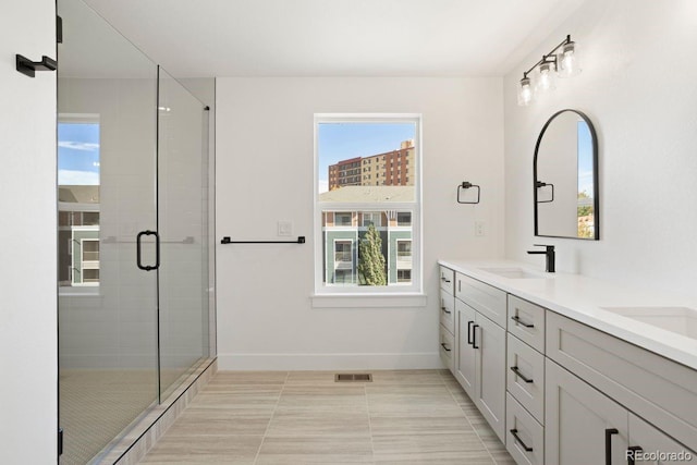 4650 W 9th Ave, Denver, CO 80204 - full bathroom with double vanity, a stall shower, and tile patterned floors