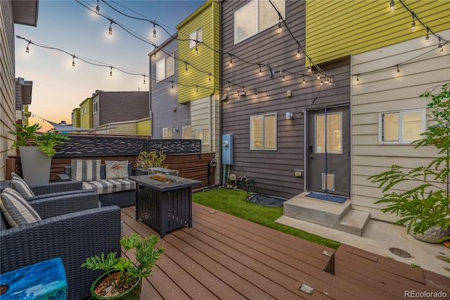 2824 W Parkside Pl, Denver, CO 80221 - wooden terrace with fence and an outdoor living space with a fire pit