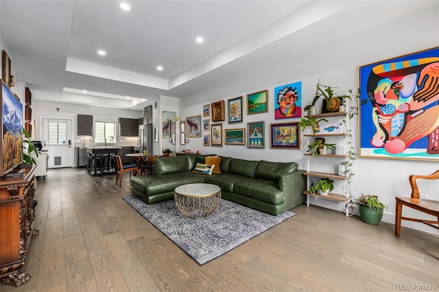 2824 W Parkside Pl, Denver, CO 80221 - living area featuring recessed lighting, a raised ceiling, and wood finished floors