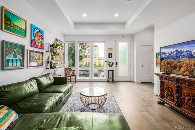 2824 W Parkside Pl, Denver, CO 80221 - living area with a tray ceiling, light wood-style flooring, baseboards, and recessed lighting