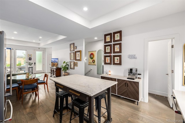 2824 W Parkside Pl, Denver, CO 80221 - interior space featuring a kitchen bar, recessed lighting, hardwood / wood-style floors, and a raised ceiling