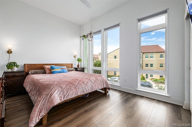 2824 W Parkside Pl, Denver, CO 80221 - bedroom featuring baseboards, wood finished floors, and visible vents