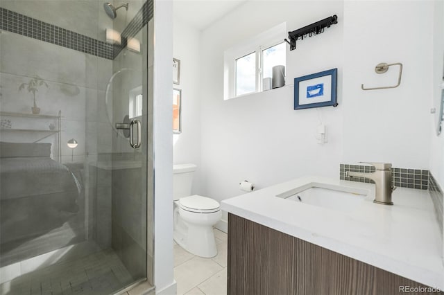 2824 W Parkside Pl, Denver, CO 80221 - full bath featuring vanity, tile patterned flooring, a shower stall, and toilet
