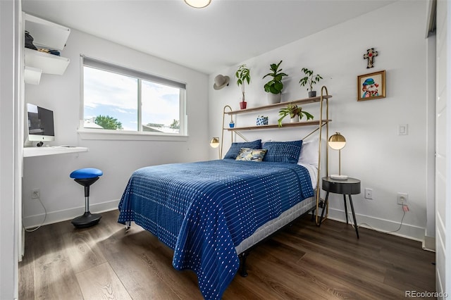 2824 W Parkside Pl, Denver, CO 80221 - bedroom with baseboards and wood finished floors