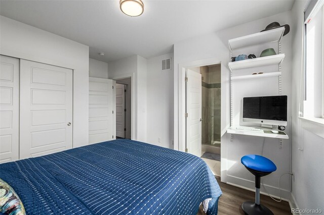 2824 W Parkside Pl, Denver, CO 80221 - bedroom featuring baseboards, visible vents, a closet, ensuite bath, and dark wood-type flooring