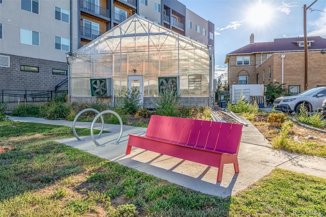 2824 W Parkside Pl, Denver, CO 80221 - view of home's community featuring an outdoor structure, a greenhouse, and fence