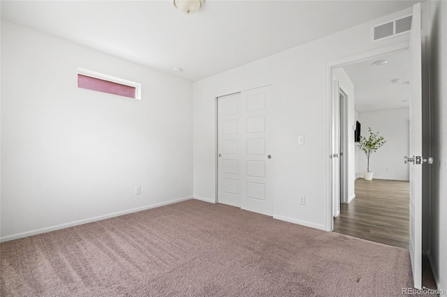 18645 E 54th Pl, Denver, CO 80249 - unfurnished bedroom with carpet flooring, baseboards, and a closet