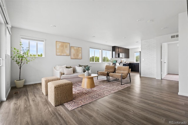 18645 E 54th Pl, Denver, CO 80249 - living area featuring dark wood finished floors and baseboards