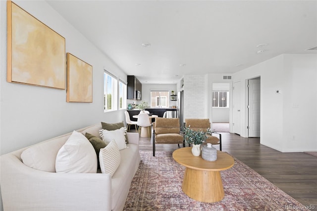 18645 E 54th Pl, Denver, CO 80249 - living room with dark wood-type flooring and baseboards