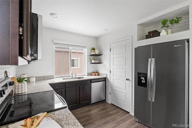 18645 E 54th Pl, Denver, CO 80249 - kitchen featuring stainless steel appliances, a sink, open shelves, light countertops, and dark wood-style floors