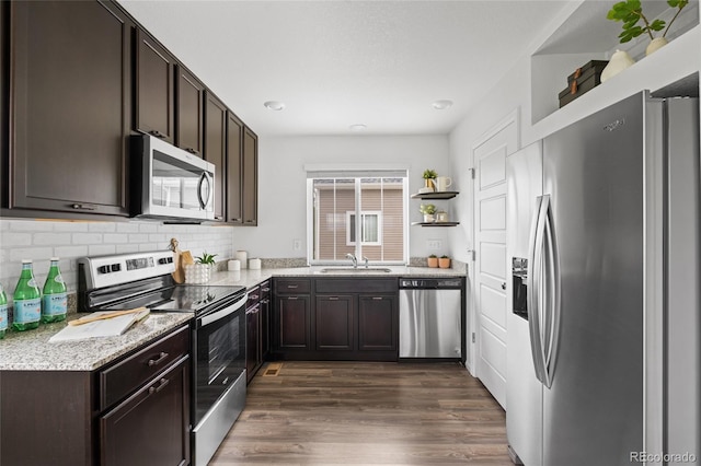 18645 E 54th Pl, Denver, CO 80249 - kitchen with stainless steel appliances, a sink, open shelves, dark brown cabinets, and recessed lighting