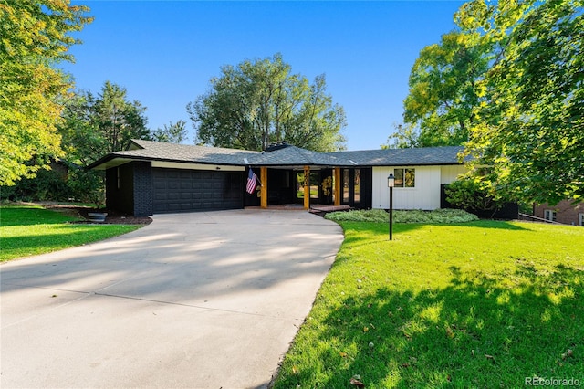 single story home featuring a front yard and a garage