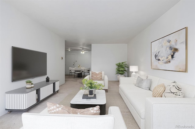 7801 W 35th Ave Unit 406, Wheat Ridge, CO 80033 - living room featuring ceiling fan and light colored carpet