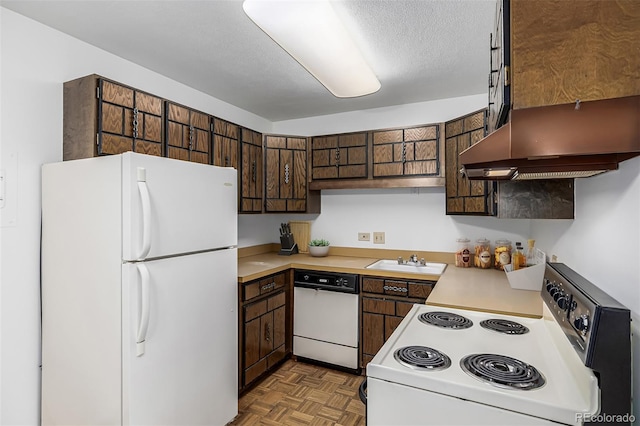 7801 W 35th Ave Unit 406, Wheat Ridge, CO 80033 - kitchen featuring a sink, extractor fan, white appliances, and light countertops