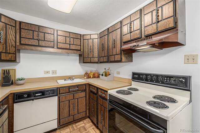 7801 W 35th Ave Unit 406, Wheat Ridge, CO 80033 - kitchen featuring light countertops, electric range oven, a sink, and white dishwasher