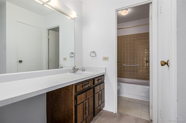 7801 W 35th Ave Unit 406, Wheat Ridge, CO 80033 - full bathroom with toilet, tile patterned flooring, vanity, and shower / washtub combination