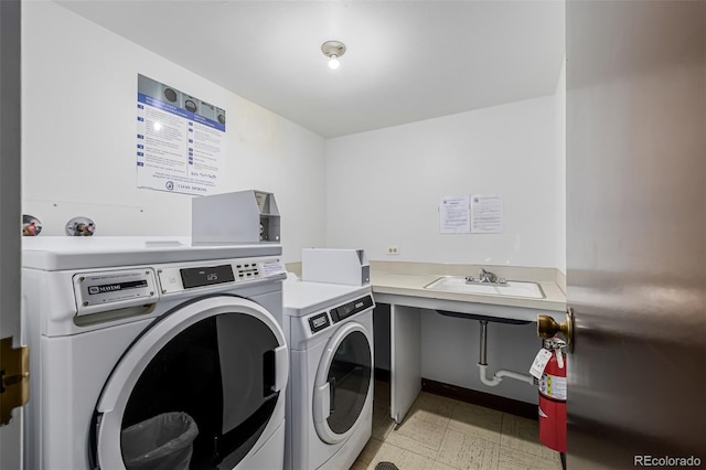 7801 W 35th Ave Unit 406, Wheat Ridge, CO 80033 - shared laundry area with washer and dryer, light floors, and a sink