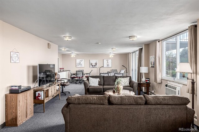 7801 W 35th Ave Unit 406, Wheat Ridge, CO 80033 - living area with carpet, baseboards, a ceiling fan, and a wall mounted air conditioner