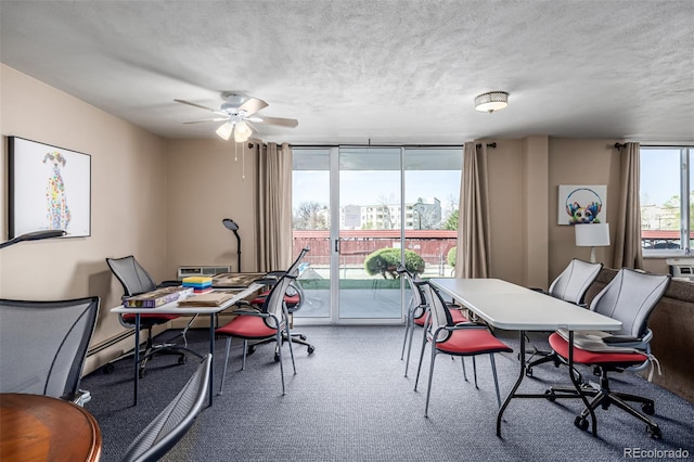 7801 W 35th Ave Unit 406, Wheat Ridge, CO 80033 - dining area with baseboard heating, floor to ceiling windows, a ceiling fan, and a textured ceiling