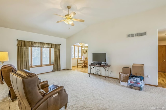 living room with a ceiling fan, visible vents, carpet flooring, lofted ceiling, and baseboards