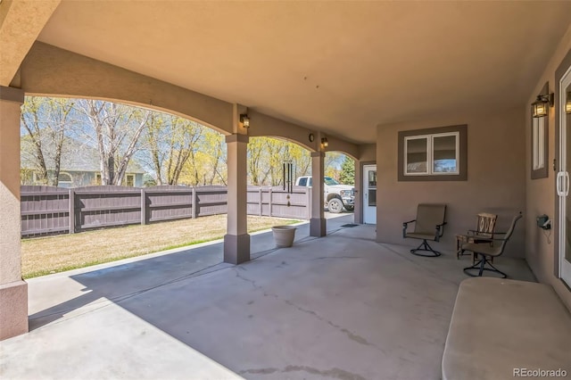view of patio featuring fence