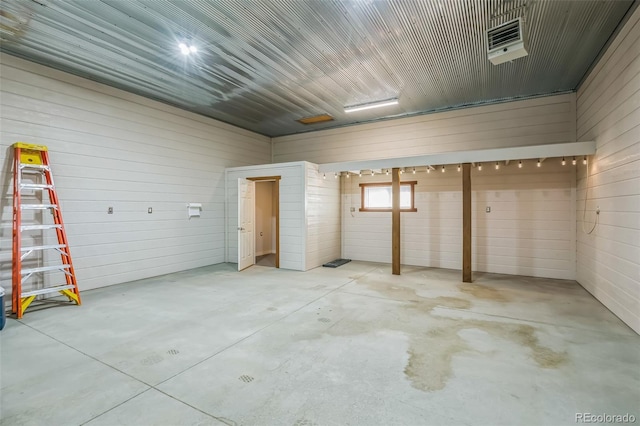 unfurnished bedroom with concrete floors and visible vents