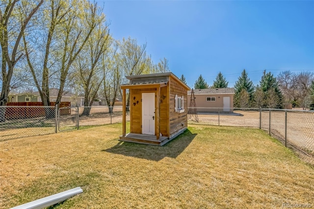 view of shed with a fenced backyard