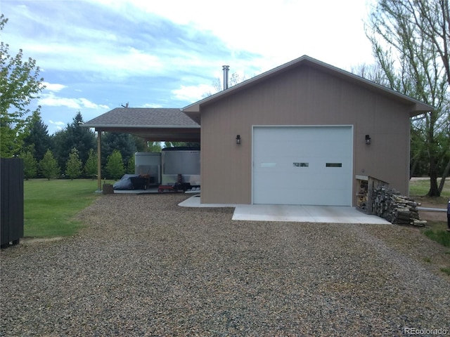 view of side of home with gravel driveway