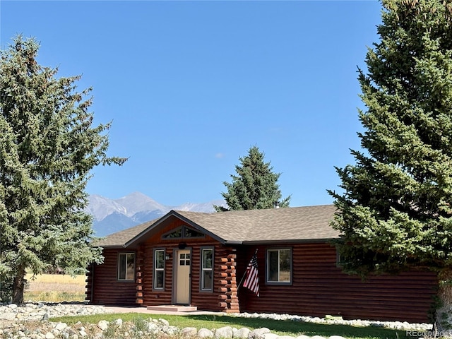 9081 Range Ln, Salida, CO 81201 - cabin featuring log exterior, a mountain view, and roof with shingles