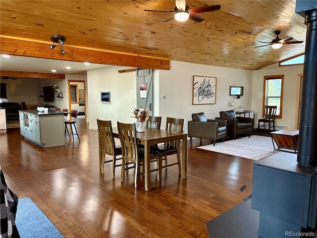 9081 Range Ln, Salida, CO 81201 - dining room featuring a wood stove, ceiling fan, recessed lighting, dark wood-style floors, and lofted ceiling