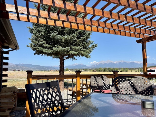 9081 Range Ln, Salida, CO 81201 - view of patio with a pergola, a deck with mountain view, and outdoor dining space