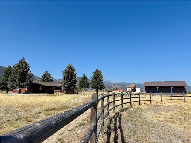 9081 Range Ln, Salida, CO 81201 - view of road with a rural view, a mountain view, and a riding arena