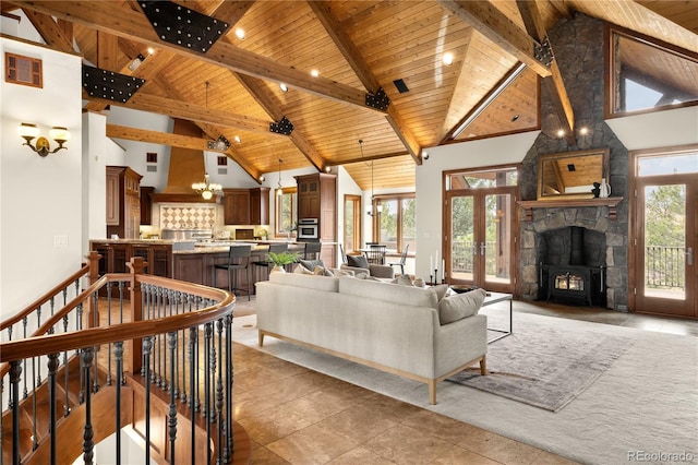 living room with wooden ceiling, beamed ceiling, visible vents, and high vaulted ceiling