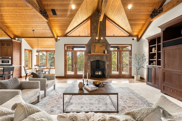 living area with wood ceiling, french doors, baseboards, and a healthy amount of sunlight