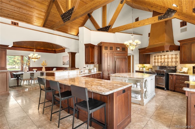 kitchen with a chandelier, visible vents, open shelves, and a sink