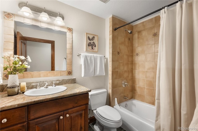 full bath with toilet, a textured ceiling, vanity, and shower / tub combo with curtain