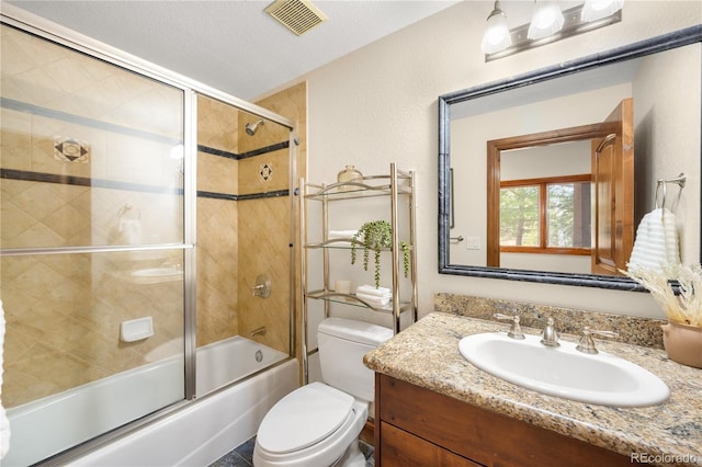 bathroom featuring vanity, visible vents, enclosed tub / shower combo, a textured ceiling, and toilet