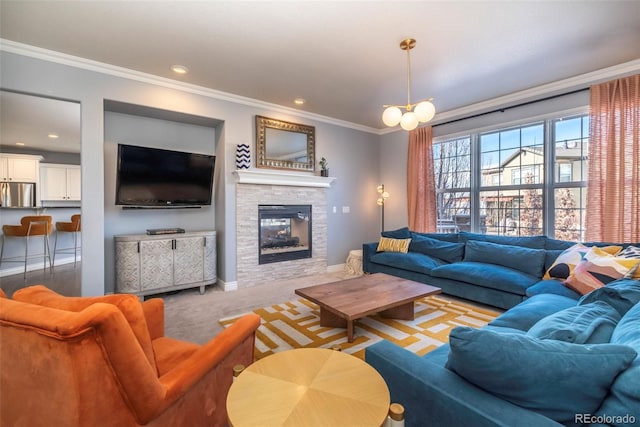 carpeted living room featuring an inviting chandelier, ornamental molding, and a stone fireplace