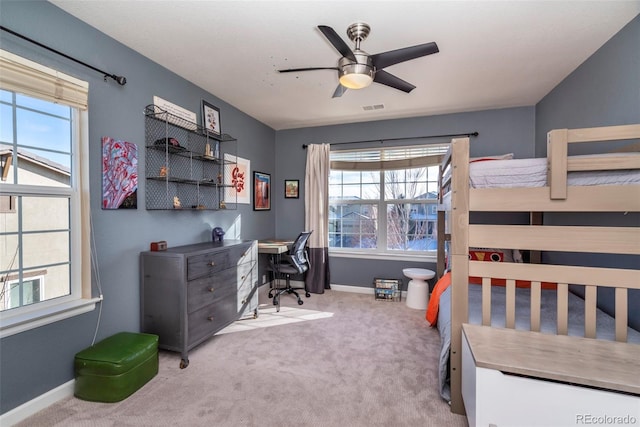 carpeted bedroom featuring ceiling fan