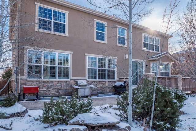 view of snow covered house