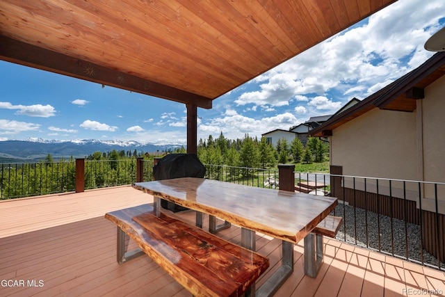 2621 Gcr 519, Tabernash, CO 80478 - wooden deck featuring a mountain view and outdoor dining area